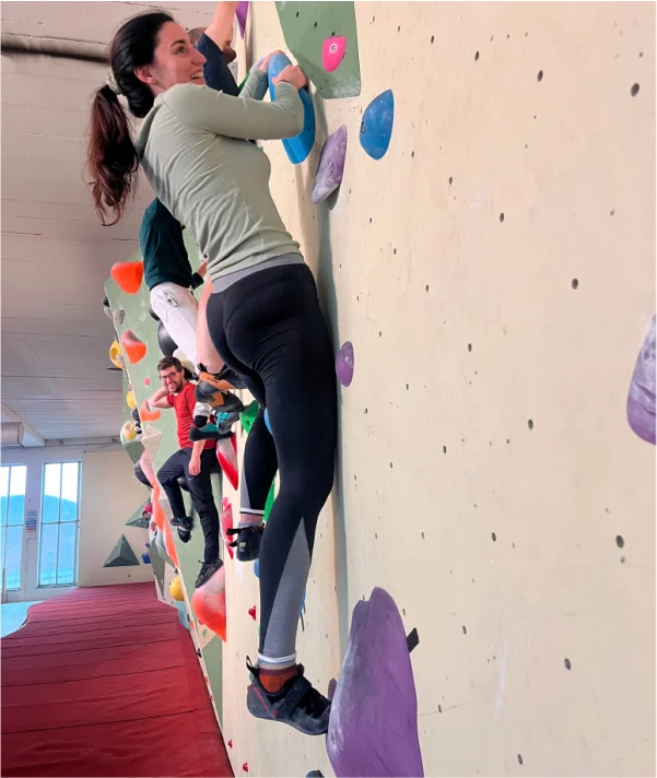 One girl climbing with her colleagues